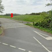 The red arrow shows where the height restriction would be at the entrance to the car park