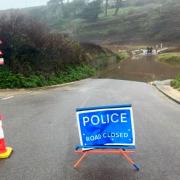 The road at Poldhu beach in Cornwall has flooded again following heavy rainfall