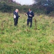 Councillors Alan Jewell and John Bastin in one of the fields to be built on