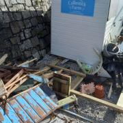 Damage to the beach huts at Castle Beach in Falmouth