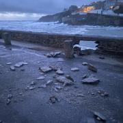 Porthleven's harbour wall finally gave way to the power of the sea on Monday