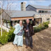 Omaze Million Pound House Draw Cornwall winner Rose Doyle with husband Tony outside their new home
