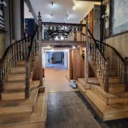 The recognisable dual staircase inside Mounts Bay Trading, now up for auction