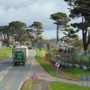 Workers replacing the perimeter fence at RNAS Culdrose
