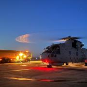 RNAS Culdrose Merlin helicopter taking off at dusk