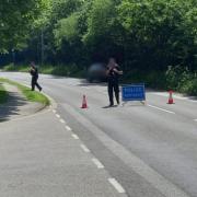 Police at the scene of the crash yesterday