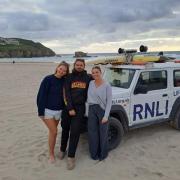 From left to right RNLI lifeguards, Rosalie Longman, George Hudson and Terri Warner