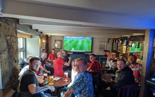 Fans watch the game in The Bell Inn, Helston