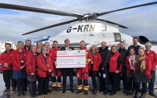 Richard Madeley presents a cheque to crew and staff of Cornwall Air Ambulance
