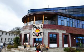 Students protesting the university's new partnership with Shell