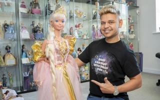 Duana AJ with his doll collection in Truro