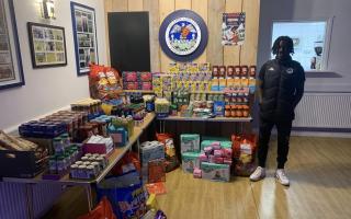 Osiah Spelman with all the donations for Helston and Lizard Foodbank