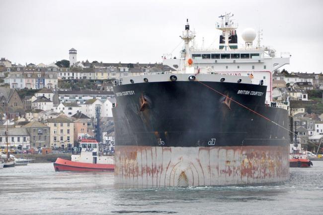 Tugs aid tanker as she berths for repairs